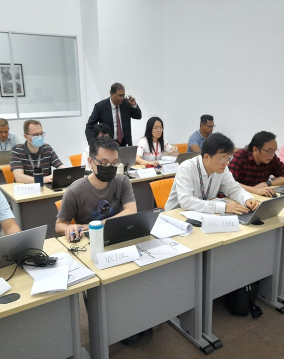 Franklin Styne guiding participants through a hands-on AI exercise in a corporate training room